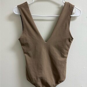 Tan body suit